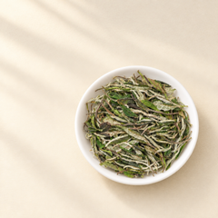 2026 White Peony dry tea leaves in white ceramic dish